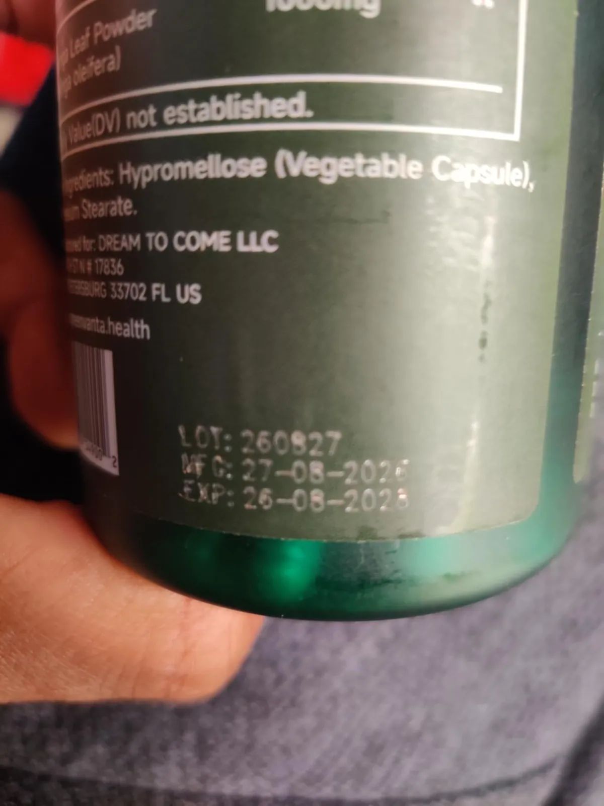 Bottom of the GREENVANTA moringa bottle label showing printed lot number, manufacture and expiry dates